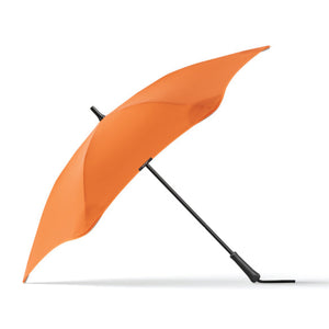 Orange umbrella with a black handle on a white background