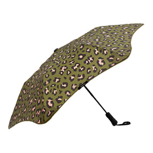 Green umbrella with a leopard print pattern on a white background