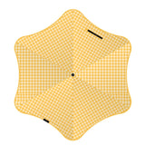Yellow checkered umbrella on a white background